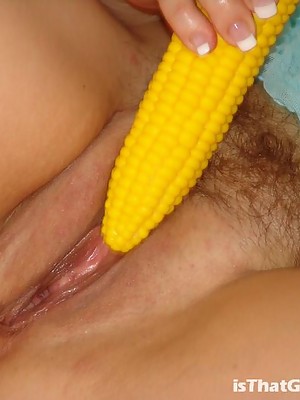 Brunette grandma sucking with lust a corn dildo